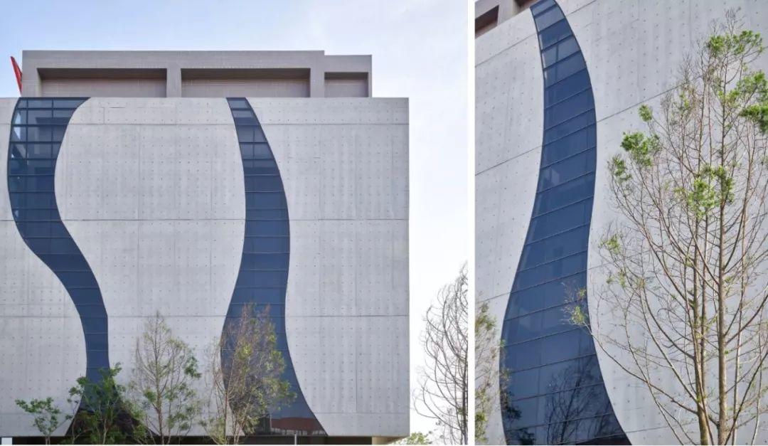 建築物北立面,以弧線劃開巨大的混凝土量體,中間崁入玻璃;攝影/林福明 光隆物流研發中心/林祺錦建築師事務所