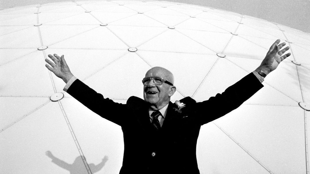 Buckminster Fuller raises his arms as he poses in front of a massive geodesic dome in Long Beach, California, on April 21, 1983. Fuller was widely known for popularizing the use of the domes. BOB RIHA JR/GETTY IMAGES
