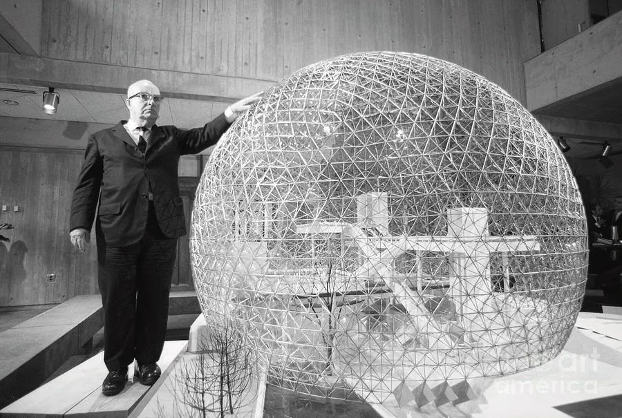 Buckminster Fuller with a model of the biosphere for the Canadia is a photograph by The Harrington