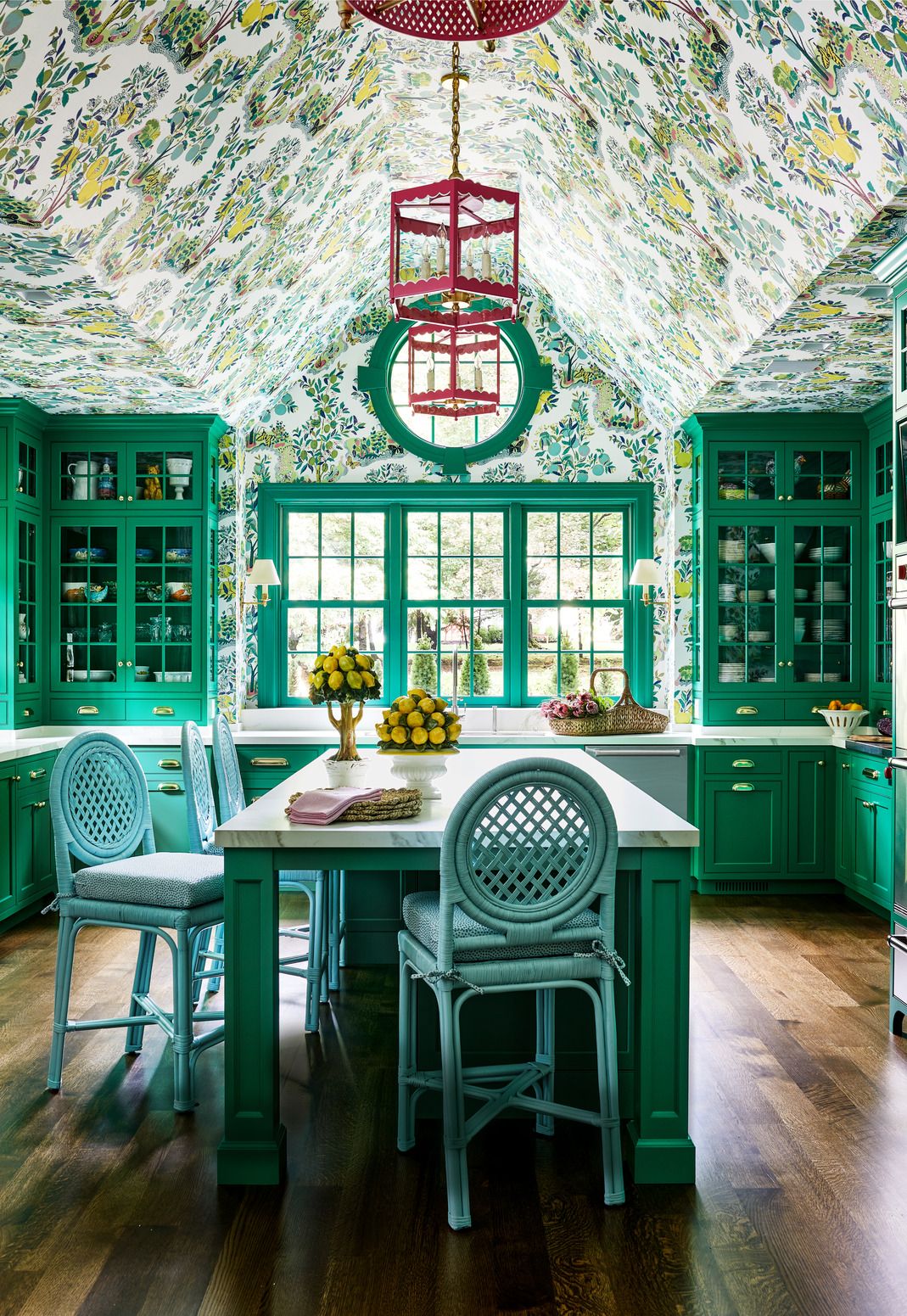 the custom green cabinetry in this kitchen by designer molly singer complements the wallpaper by schumacher ©Stacy Zarin Goldberg