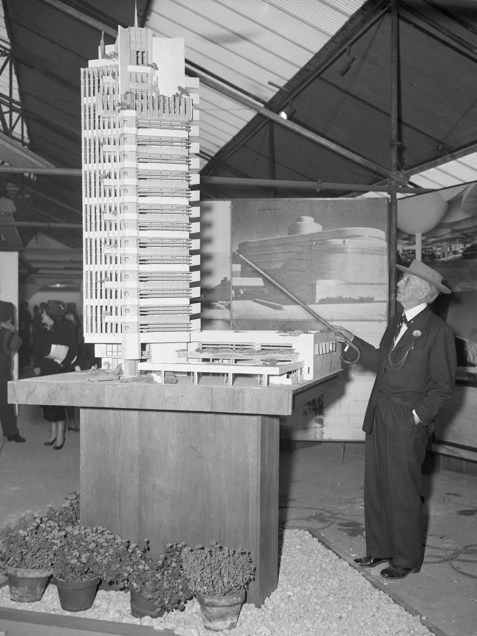 Wright, with a model of Price Tower in Oklahoma. “Now the skyscraper comes into its own,” he said at the building’s dedication, in 1956, “on the rolling plains of Oklahoma.”Credit...Bettmann, via Getty Images