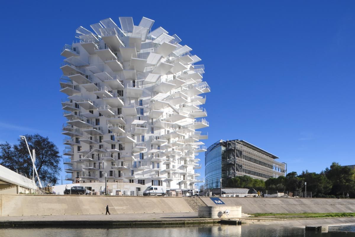 Sou Fujimoto, Nicolas Laisné, Dimitri Roussel and OXO architectes collaborate on L’Arbre Blanc, a bright, white, sculptural residential scheme in Montpellier, France.(Image credit: SFA+NLA+OXO+DR)